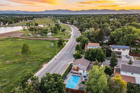 View of backyard and beautiful Colorado sunset and view of the lake & pool.