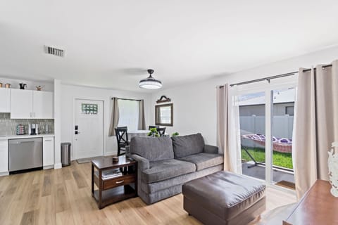 SUPER comfy couch!
Sliding glass doors lead to private backyard.