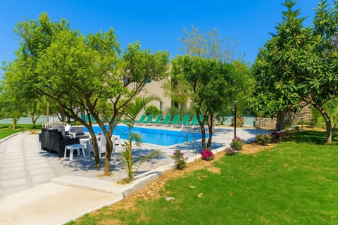 Immerse yourself in the tranquil beauty of the property's garden and swimming pool