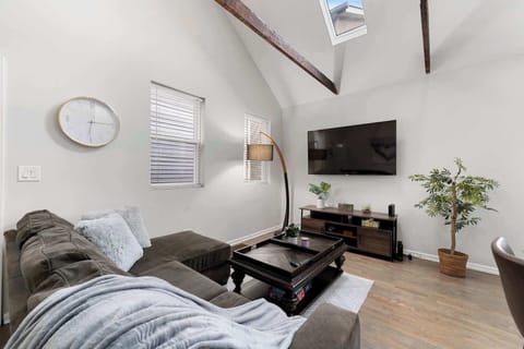 Cozy bedroom scene w/ layered textures & a relaxed, uncluttered feel.