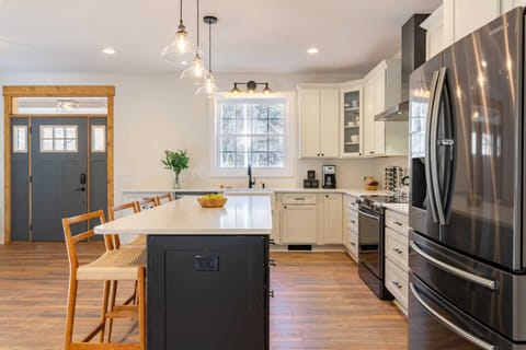 Prepare delicious meals in a fully equipped kitchen boasting sleek granite surfaces and top-tier appliances. - The Regal - Sevierville, TN