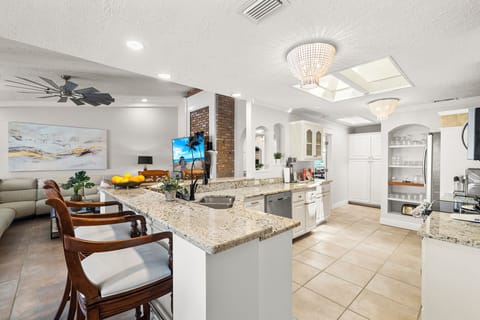Welcome to our newly renovated kitchen, where sleek stainless steel appliances await your culinary adventures.