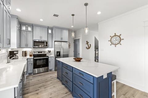 Cook like you’re home—fully stocked Galveston Island kitchen with the signature KitchenAid Stand Mixer and plenty of prep space.