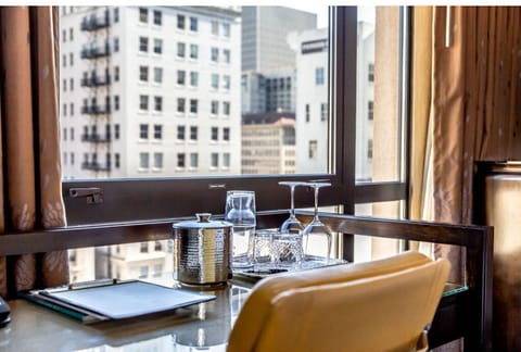 Set against the city skyline, this cozy nook is the perfect spot for contemplation or catching up on work.