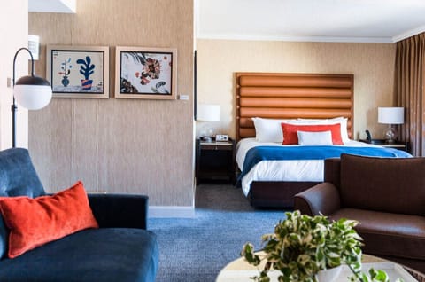 An inviting space thoughtfully designed for accessibility, featuring a comfortable king bed and convenient amenities.