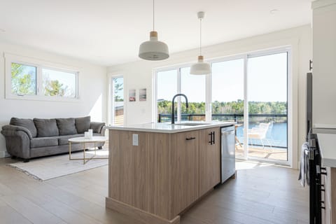 The open-concept living area is on the upper level and has beautiful lake views!