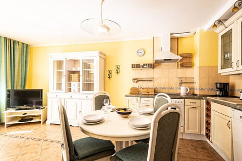 dining room table and kitchen on the upper floor