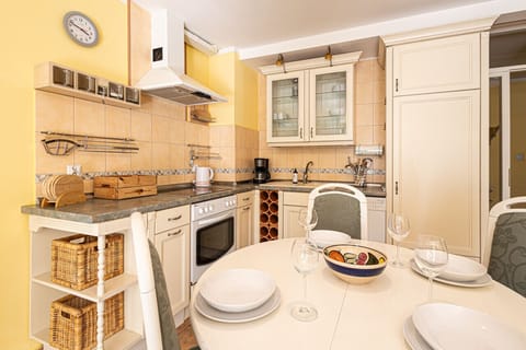 dining room table and kitchen on the upper floor