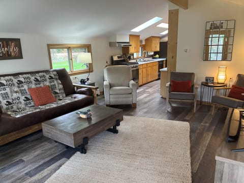 Cozy family room with lake view, big screen TV and lots of seating