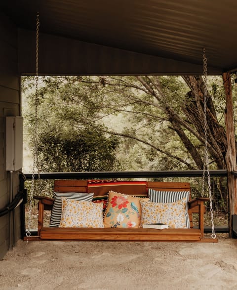 The porch swing on the front patio.