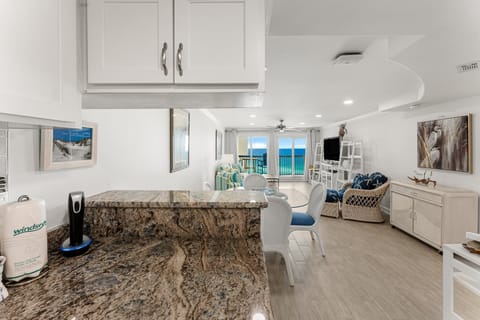 Kitchen is open to the dining/living room. You can serve appetizers on the extended counter.