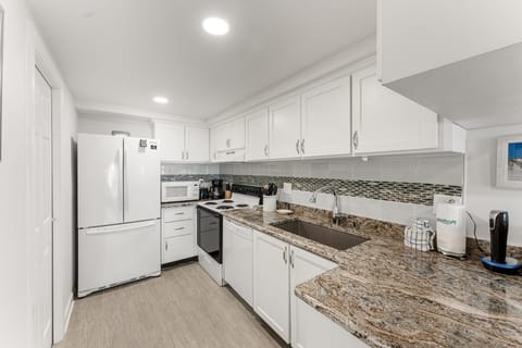 Fully equipped kitchen where great meals can be made. Kitchen boasts tile backsplash and granite counters.