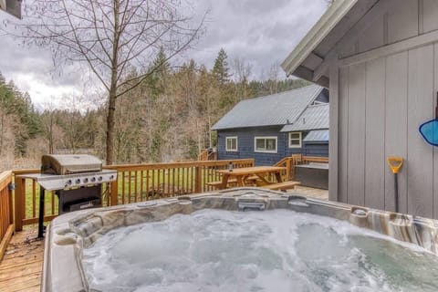 Soak under the stars, fire up the grill, and chill in the trees—this dreamy hot tub deck is your private escape with serious Pacific Northwest vibes. 