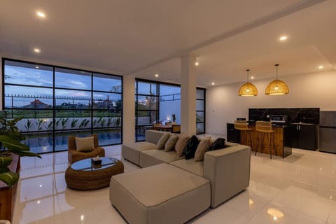 Open-concept living space bathed in the warm glow of dusk.