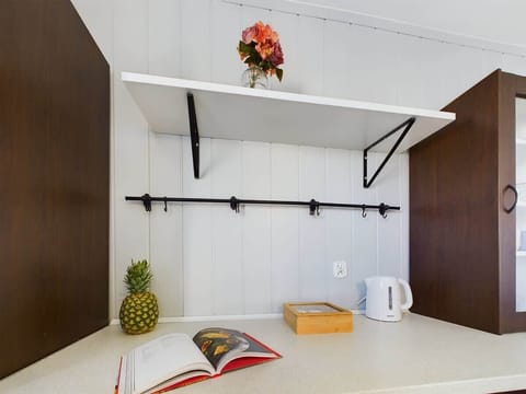 Modern kitchen space with high stools and a clean, bright ambiance.


