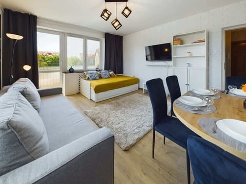 Charming living space with plush seating and modern decor, ideal for relaxing.

