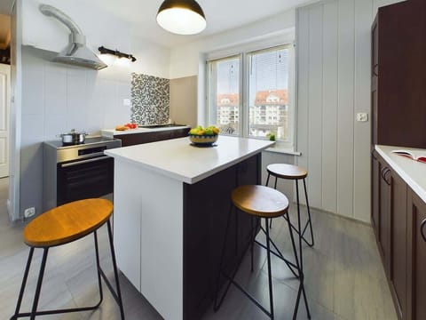 Compact and practical kitchen corner equipped with cooking essentials.

