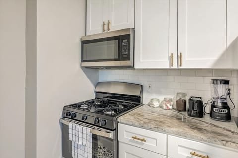 Fully stocked kitchen with counter height seating