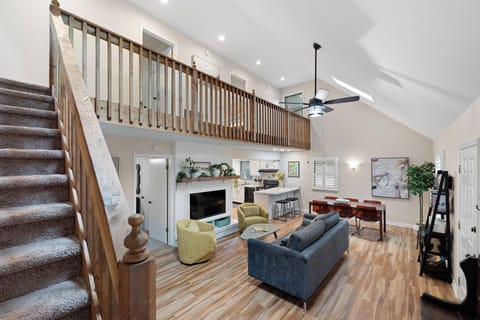 Main living area w/view to dining area, and kitchen breakfast bar