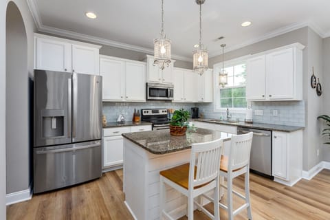[Kitchen] Stainless steel appliances, with nearby office nook and garage access.