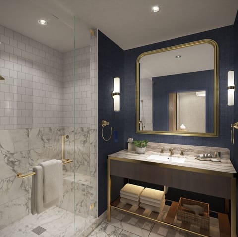 Get ready comfortably at a spacious vanity with bright lighting.