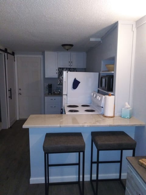 Counter with barstools.