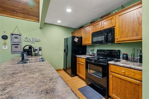 Well appointed kitchen with stove/oven, refrigerator/freezer, and dishwasher