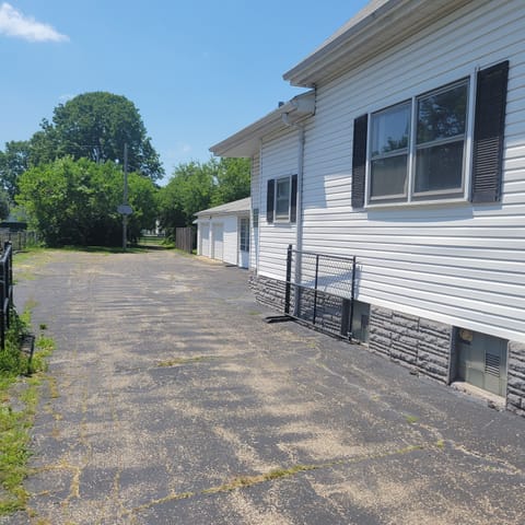 Driveway Left Side of House to Large Parking Area.