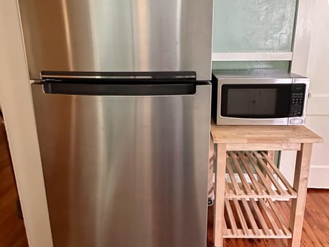 We have a stainless steel fridge and microwave oven.