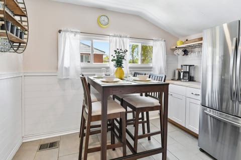 A sunny breakfast nook just off the kitchen with coffee bar