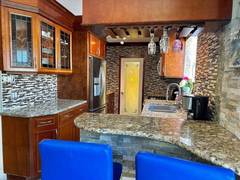 Our gorgeous, gourmet kitchen, features, stunning granite countertops, a beautiful backsplash and a gas range complemented by sleek stainless steel appliances. Equipped with everything you need to whip up a simple breakfast or gourmet meal, this spac