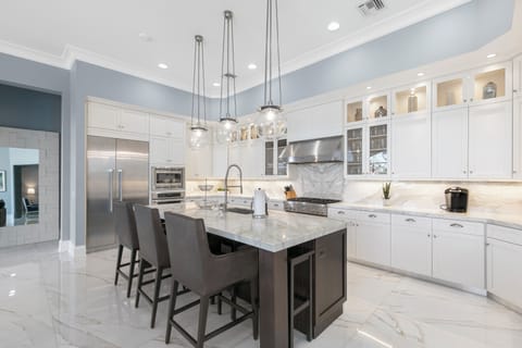 Prepare meals on the granite countertops and expansive island.