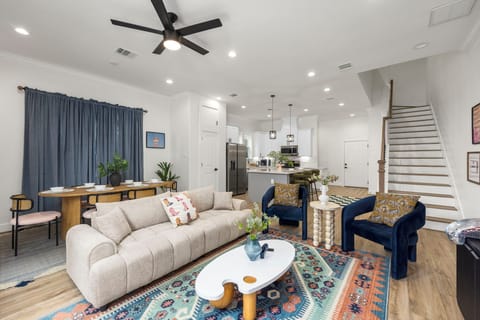 Cozy living room with ceiling fan and the dining area at the back