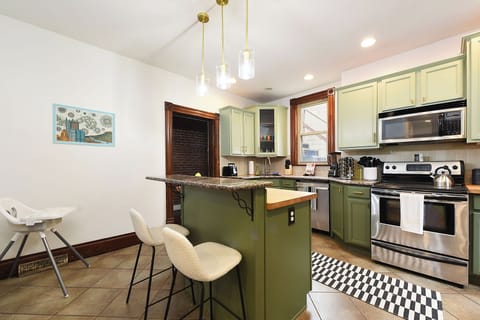 The kitchen island for 2 and high chair