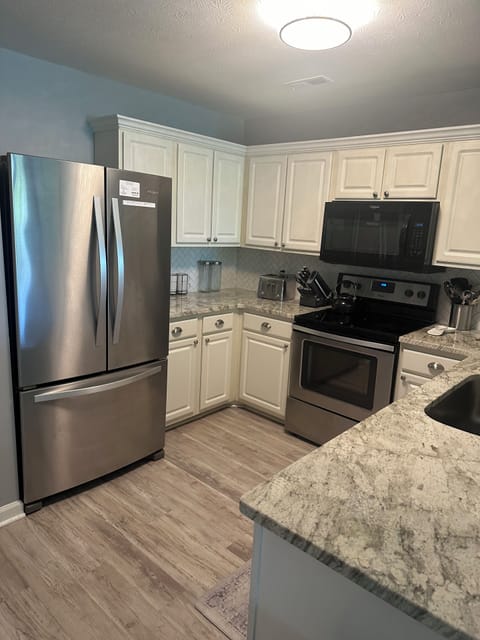 Upgraded kitchen with granite counter tops.