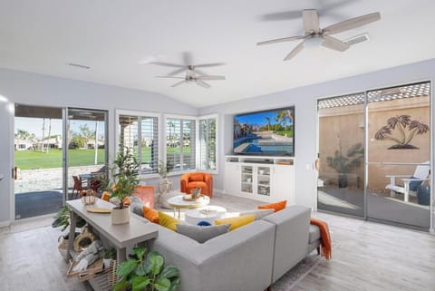 Spacious living room with views of the backyard & golf course. 
