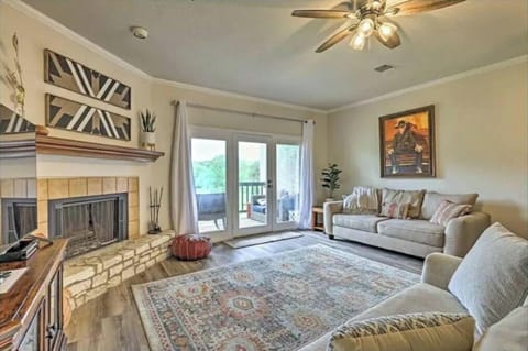 Beautiful living room with wood burning fireplace and view of the deck