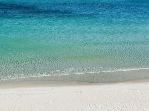 Beautiful white sand private beach with emerald waters 
