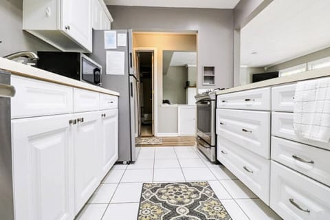 Welcome to our fully equipped kitchen, featuring modern appliances and essential tools. Enjoy cooking in a space where convenience meets functionality, making meal prep a breeze.