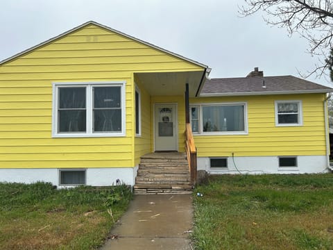 Welcome to our vacation rental. This is The Homestead. It's a happy yellow and we hope you enjoy it.