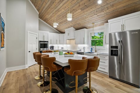 Full kitchen with all cooking essentials and island for additional seating (This is one of two kitchens in the home!)