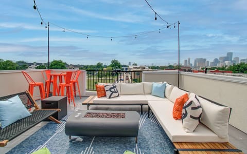 Unwind under the stars on our rooftop patio featuring cozy lounge seating