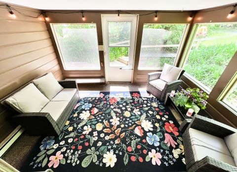 The screen porch is the place to sit and enjoy the outdoors without mosquitos!
