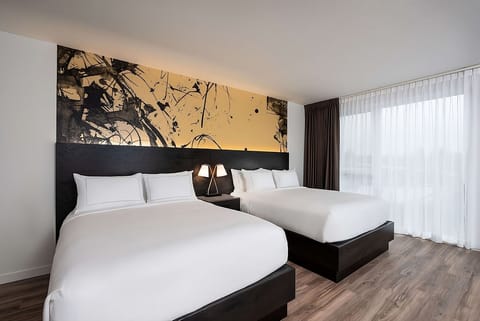 Stretch out in plush beds under warm, gallery-style lighting.