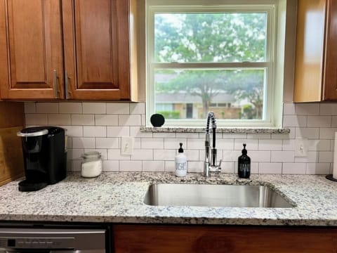 Sink + coffee maker at the kitchen counter
