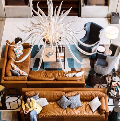 Discover a corner of intrigue in our lobby, featuring an eclectic mix of artistic elements and plush seating for intimate meaningful conversations.