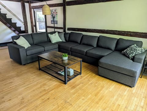 Relax in style in our open-concept living area, featuring a large Smart TV and high-speed WiFi for all your streaming needs.