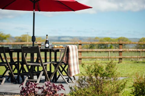 Fantastic views from the patio: outdoor table with four chairs and parasol
