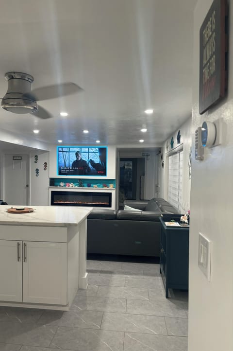 Coming into our home, entering in the open concept kitchen/dining/living room.