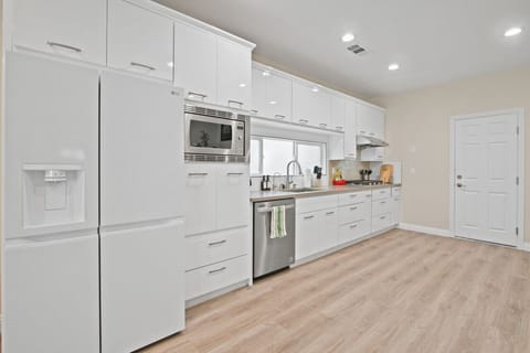 Cook delicious meals in our modern kitchen, equipped with a stovetop, rice cooker, and all essential utensils.